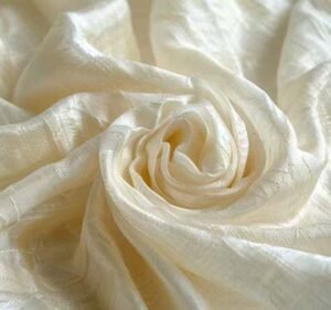 Soft ivory peace silk fabric representing ethical silk production and sustainable luxury textiles